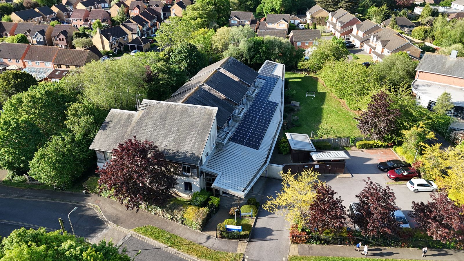 Aerial drone view of a commercial rooftop solar installation