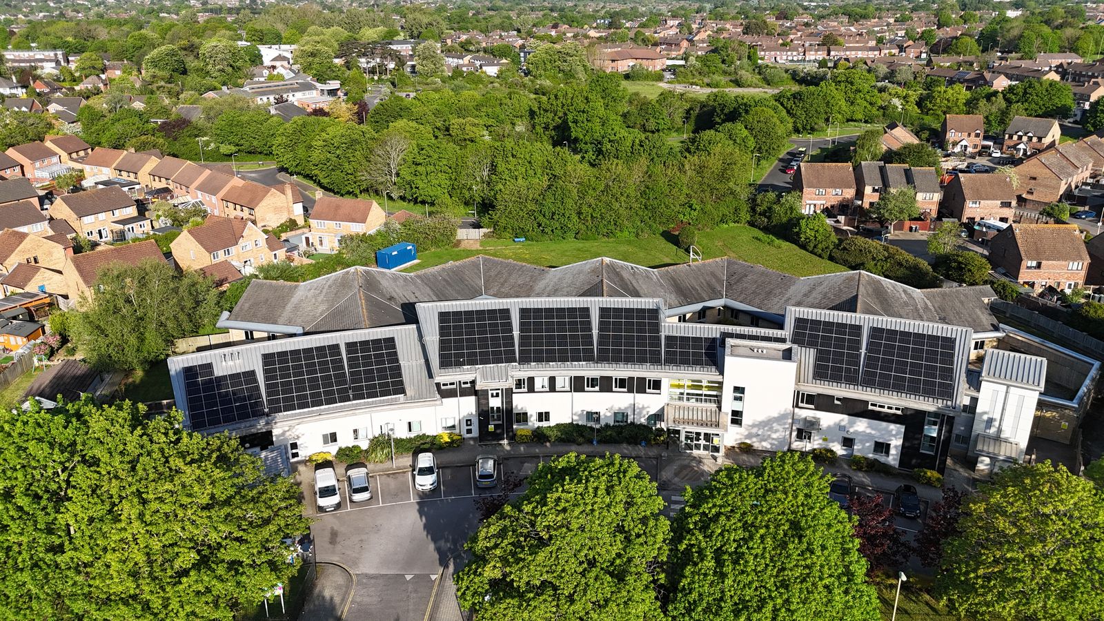 Aerial drone view of a commercial rooftop solar installation