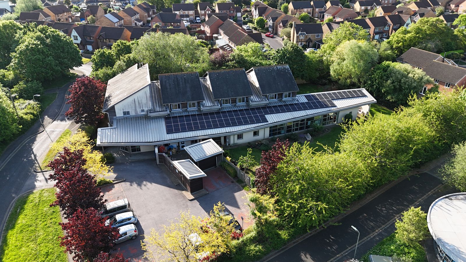 Aerial drone view of a commercial rooftop solar installation